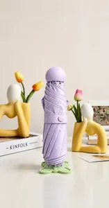 Close-up of creative flower-shaped umbrella stand base for folding umbrellas