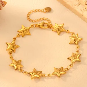 Macro detail view of minimalist gold star bracelet crafted from polished titanium steel