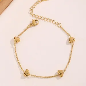 Detailed close-up of a minimalist gold heart necklace made of durable titanium steel