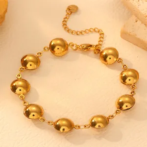 Detailed shot of golden minimalist titanium steel geometric domed round bracelet for women