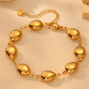 Detailed view of a minimalist gold-plated titanium steel bracelet with teardrop links