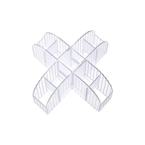 Transparent X-shaped acrylic makeup organizer with vertical ribbing for desktop storage.