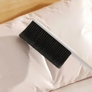 2-in-1 multi-functional cleaning brush for bed, sofa and dust removal with soft bristles.