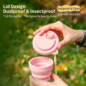 Pink collapsible silicone travel cup with cute bear lid and strap in outdoor setting