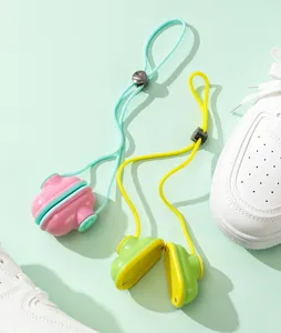 Detail view of portable shoe deodorizer balls in pink and green with adjustable cords