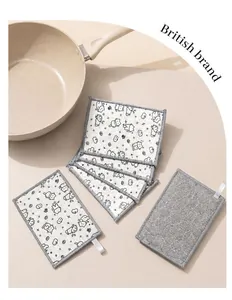 Detailed view of the thickened double-sided dishcloth with cute cartoon cat prints.