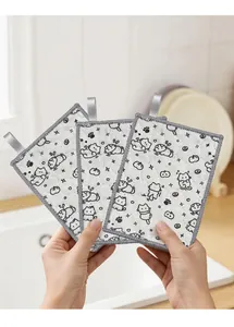 Detailed view of three absorbent kitchen dishcloths with cute cartoon cat patterns