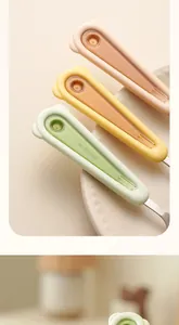 Close-up detail of cute bear-shaped handles on 2-in-1 stainless steel fruit spoon forks