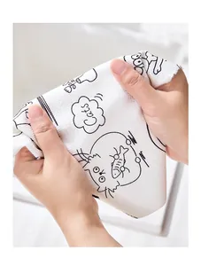 Close-up of disposable kitchen cleaning cloth with cute cat pattern and thick texture