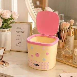 Kawaii yellow mini desktop trash can with pink pop-up lid for office and vanity table decor