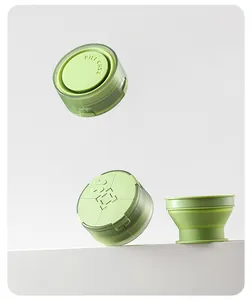 Light green portable 4-compartment pill case with built-in collapsible cup detail