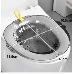 Detail showing dimensions of the gray transparent sitz bath basin on a white toilet