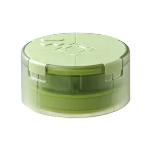 Portable 4-compartment travel pill box in light green for moisture-proof storage