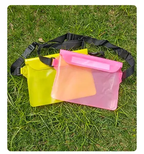 Detail of durable waterproof PVC waist bags in pink and yellow for swimming outdoors