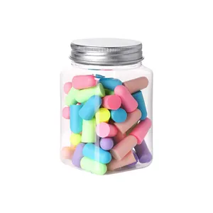 Set of multi-colored foam earplugs for sleeping in a transparent jar with a silver lid
