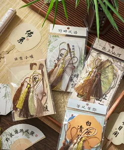 Close-up of traditional Chinese style fan-shaped bookmarks with elegant silk tassels