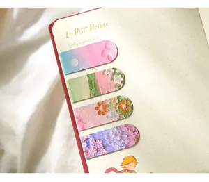 Close-up detail of artistic magnetic bookmarks with textured oil painting floral patterns