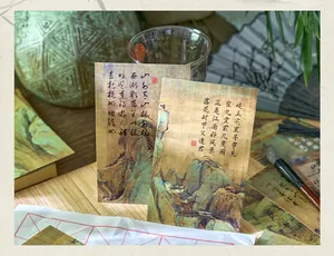 Detail view of retro Chinese style postcards with traditional landscape art and poetry decoration