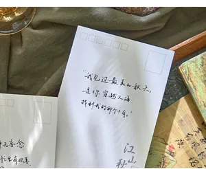 Macro detail of a Chinese style postcard featuring elegant handwritten calligraphy