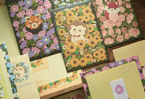 Detailed view of the Four Seasons Flower animal stationery set with gold stamping.