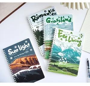 Primo piano di quattro taccuini a spirale A5 con copertine panoramiche e testo inglese.