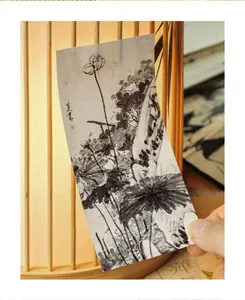 Detailed view of long sticker strip featuring traditional Chinese ink lotus painting
