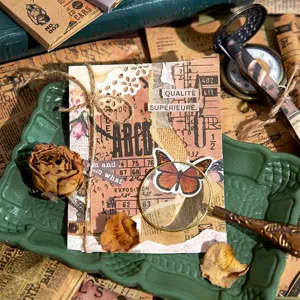Vintage scrapbooking paper set with butterfly and collage designs for DIY journals.