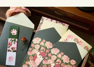 Detail of vintage floral stationery set with gold foil envelopes and cute fox illustration