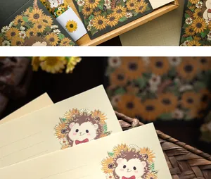 Close-up of cute hedgehog and sunflower illustration with gold foil stamping on stationery