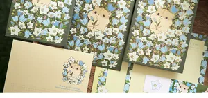 Detail view of the cute hamster floral stationery set featuring gold foil letter envelopes