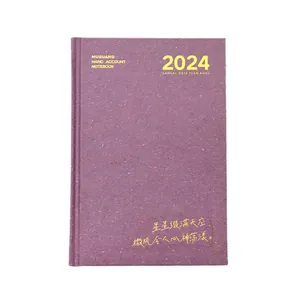 Jaarlijkse planner 2024 met paarse textuur omslag en gouden belettering