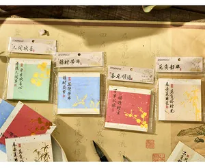 Detailed view of Zaomo Sansheng Yanhuo series memo pads with elegant gold foil patterns