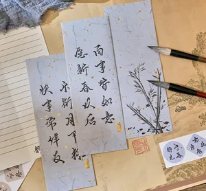 Close-up of Chinese calligraphy paper cards and ink brushes