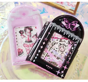 Close-up of Y2K style arched sticker books with anime girl designs and lace patterns.