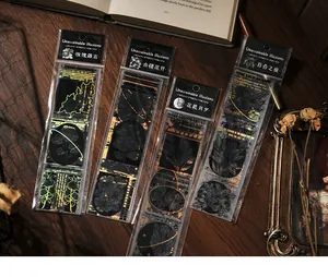 Close-up of vintage gold foil botanical stickers for DIY scrapbooking decor
