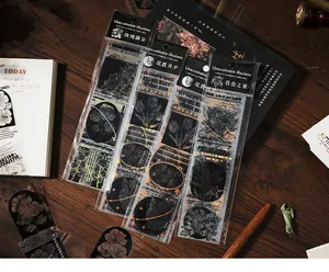 Close-up of vintage floral sticker pack with gold foil detailing for DIY journaling.