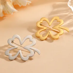 Elegant titanium steel four-leaf clover brooch set in gold and silver finish.