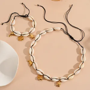 Natural cowrie shell necklace and bracelet set with gold fish, turtle and dolphin charms