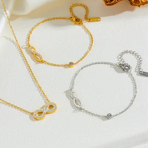 Élégant ensemble de bijoux en acier inoxydable avec pendentifs infini et strass brillants.