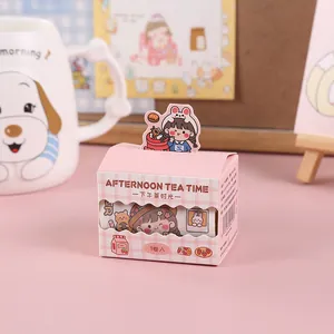 Close-up view of cute pink afternoon tea theme washi tape box for DIY scrapbooking