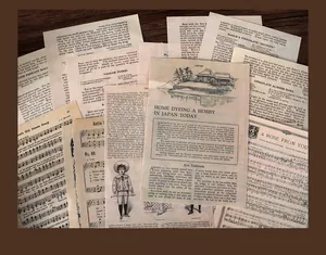 Macro view of vintage-style aged book pages and sheet music for scrapbooking