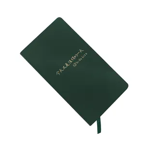 Dark green leather hardcover notebook with gold embossed To-Do List text on cover