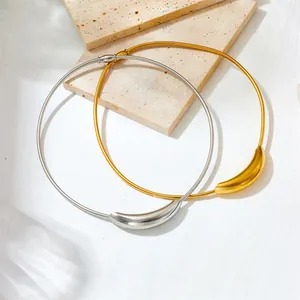 Elegant titanium steel snake bone chokers with gold and silver curved tube charms.