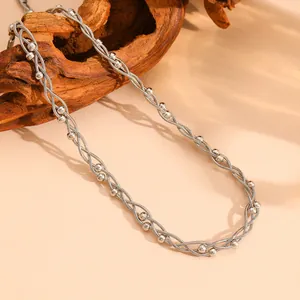 Detailed view of the multi-strand braided stainless steel silver necklace with metal beads.