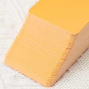 Stack of premium yellow blank flashcards for DIY graffiti on white fabric background