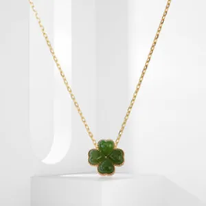Close-up of S925 silver necklace featuring a green jade four-leaf clover pendant.