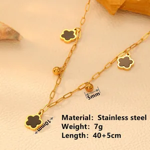 Detail view of gold stainless steel necklace with black clover charms and size specs.