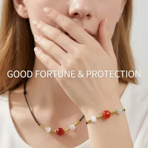 Handmade red agate bead woven bracelet and necklace set for couples with gold accents
