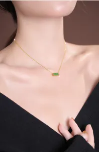 Close-up of elegant S925 silver necklace with rectangular green jade pendant