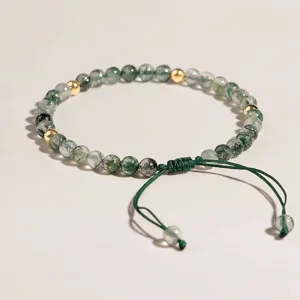 Handmade green moss agate beaded bracelet with gold accents and adjustable woven rope